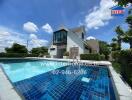 Modern house with pool under a blue sky