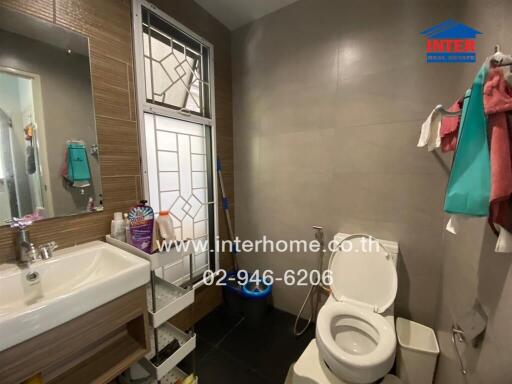 Modern bathroom with sink, toilet, and shower