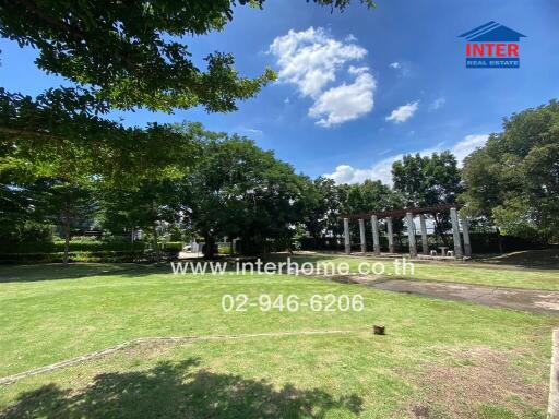 Lush green garden area with shaded seating