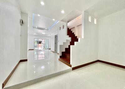 Spacious and modern main living area with staircase