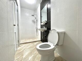 Modern bathroom with shower and toilet