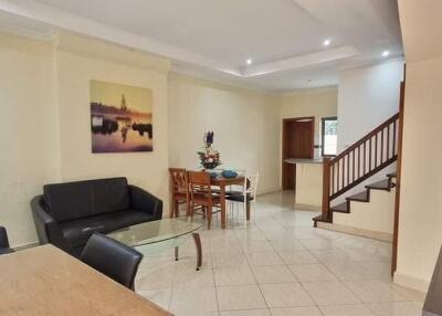 Modern living room with dining area and staircase