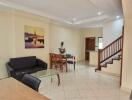 Modern living room with dining area and staircase