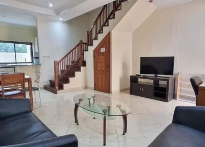 Living room with furniture and staircase