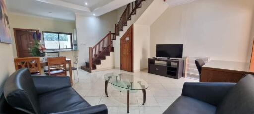 Living room with furniture and staircase