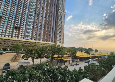 High-rise residential building exterior with street view