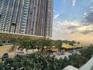 High-rise residential building exterior with street view