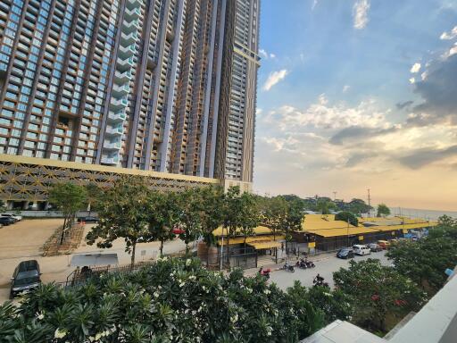 High-rise residential building exterior with street view