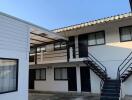 Two-story apartment building with outdoor stairs