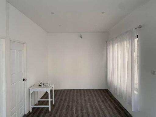 Minimalist empty living room with table and white curtains