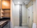 Modern bathroom with shower, sink, and storage cabinets