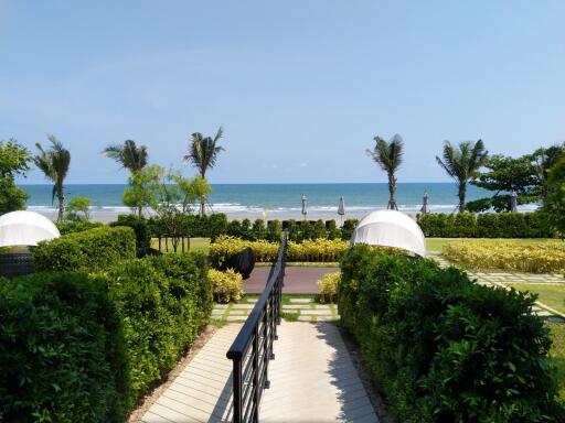 view of garden area leading to the beach