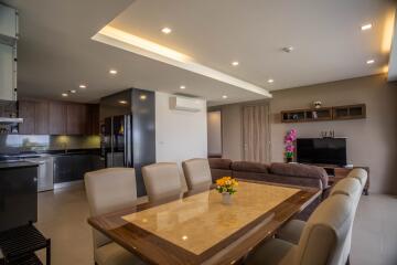 Modern open-concept living area with kitchen and dining space