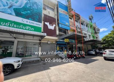 Exterior view of a commercial building with signage