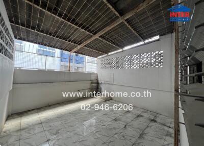 Enclosed and partially open balcony with tiled flooring