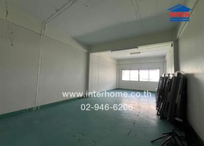 Empty room with large windows