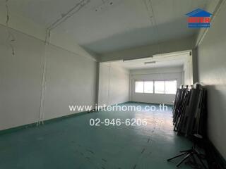 Empty room with large windows