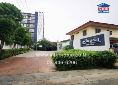 Entrance of real estate property with company branding