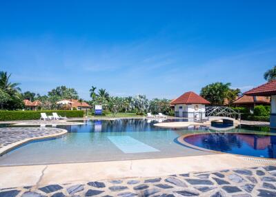 Outdoor swimming pool with seating and beautiful landscape