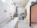 Kitchen with tiled walls and countertops