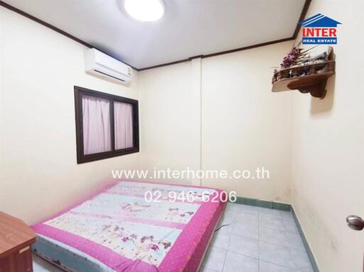 Simple bedroom with mattress and air conditioner