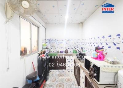 Bright kitchen with appliances and decorative wall tiles