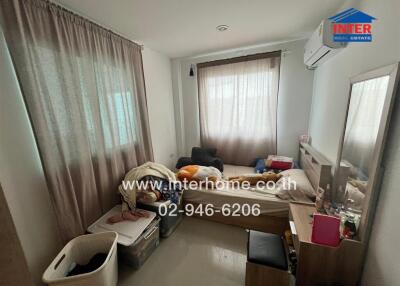 Bedroom with natural light and simple furnishings