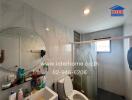 Modern bathroom with shower and various amenities