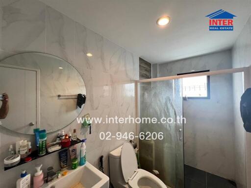 Modern bathroom with shower and various amenities