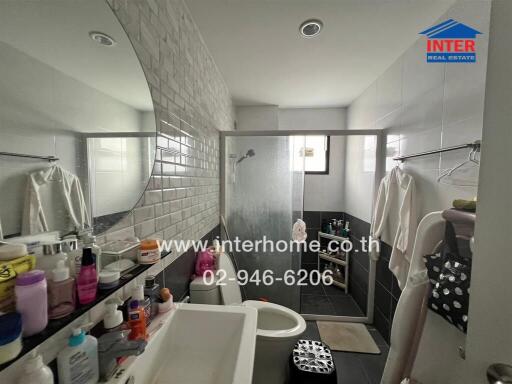 Bathroom with modern fixtures and ample storage