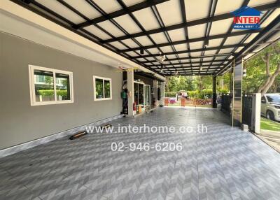 Covered garage space with tiled flooring