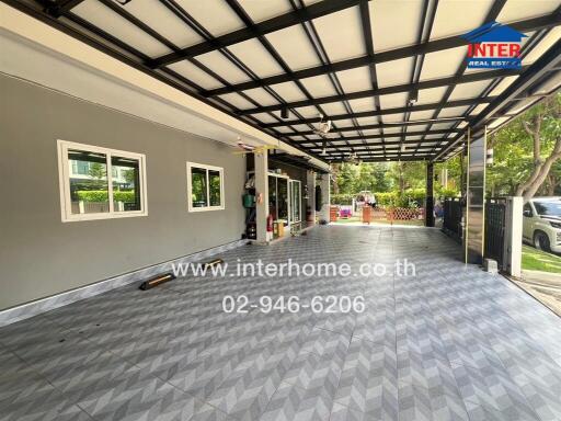 Covered garage space with tiled flooring