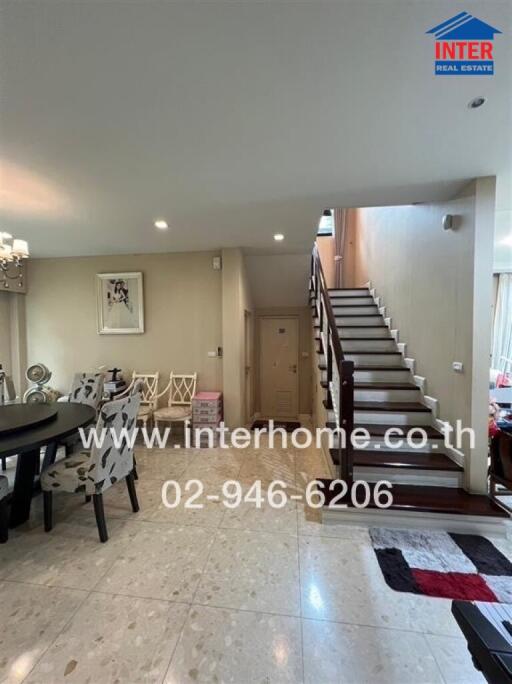 Modern living space with dining area and staircase