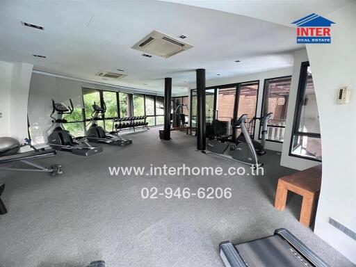 Spacious fitness center with various exercise equipment