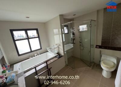 Modern bathroom with glass shower and bathtub