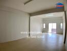 Spacious unfurnished living room with large windows and natural light