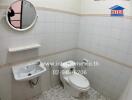 Bathroom with tiled walls and flooring, featuring a toilet, sink, and a mirror.