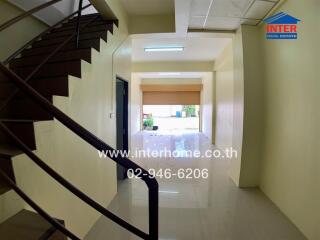 Property entryway with staircase and reflective flooring