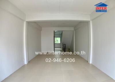 Spacious living area with adjoining corridor