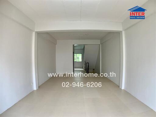 Spacious living area with adjoining corridor