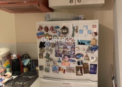 Cozy kitchen with decorated refrigerator