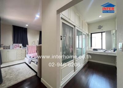 Spacious bedroom with built-in wardrobe and dressing area