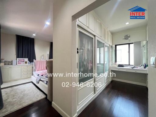 Spacious bedroom with built-in wardrobe and dressing area