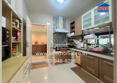 Modern kitchen with wooden cabinets and appliances