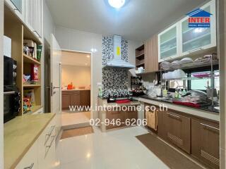 Modern kitchen with wooden cabinets and appliances