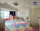 Children's bedroom with play area and colorful mat