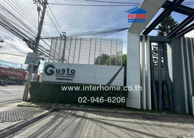 Entrance gate of a property with signage and contact information