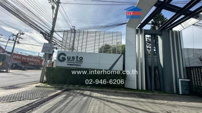 Entrance gate of a property with signage and contact information