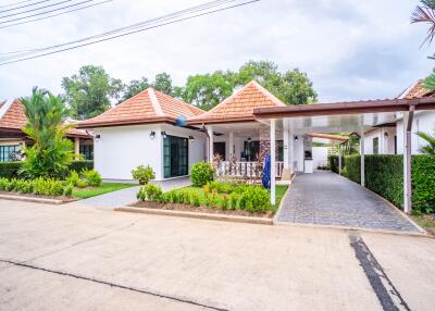 Front view of a house with garden and driveway