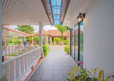 Covered walkway near the entrance of a house with plants